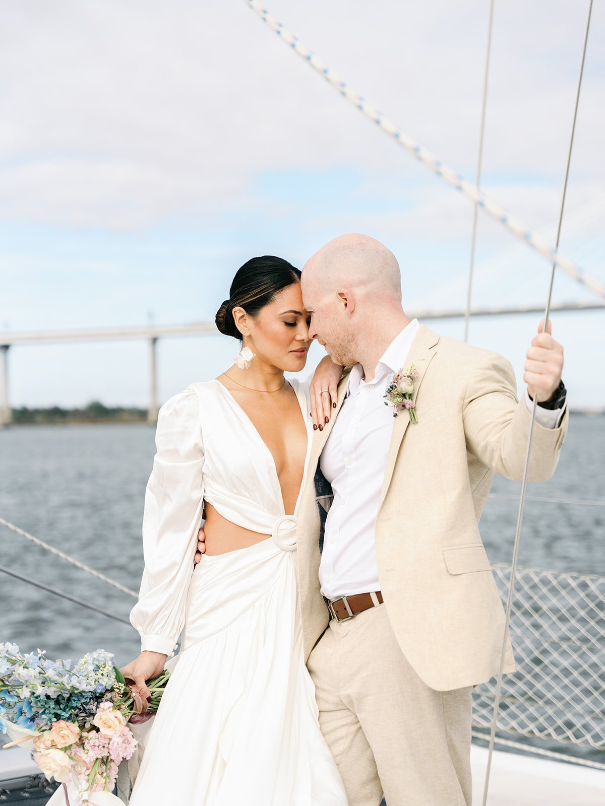 bride and groom on south carolina sailboat